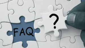 FAQ in the middle of puzzle pieaces to augment the article titled: Rent to Buy Cars: FAQs