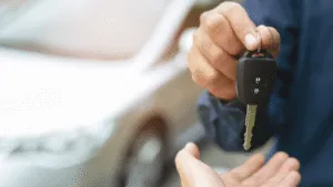 Keys being given to a client for their vehicle which augments the blog article titled: Rent to Buy vs Car Financing: Renault Kwid