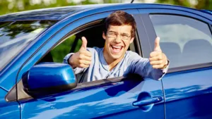 Excited young man who is augmenting the blog article titled first rent to buy car.